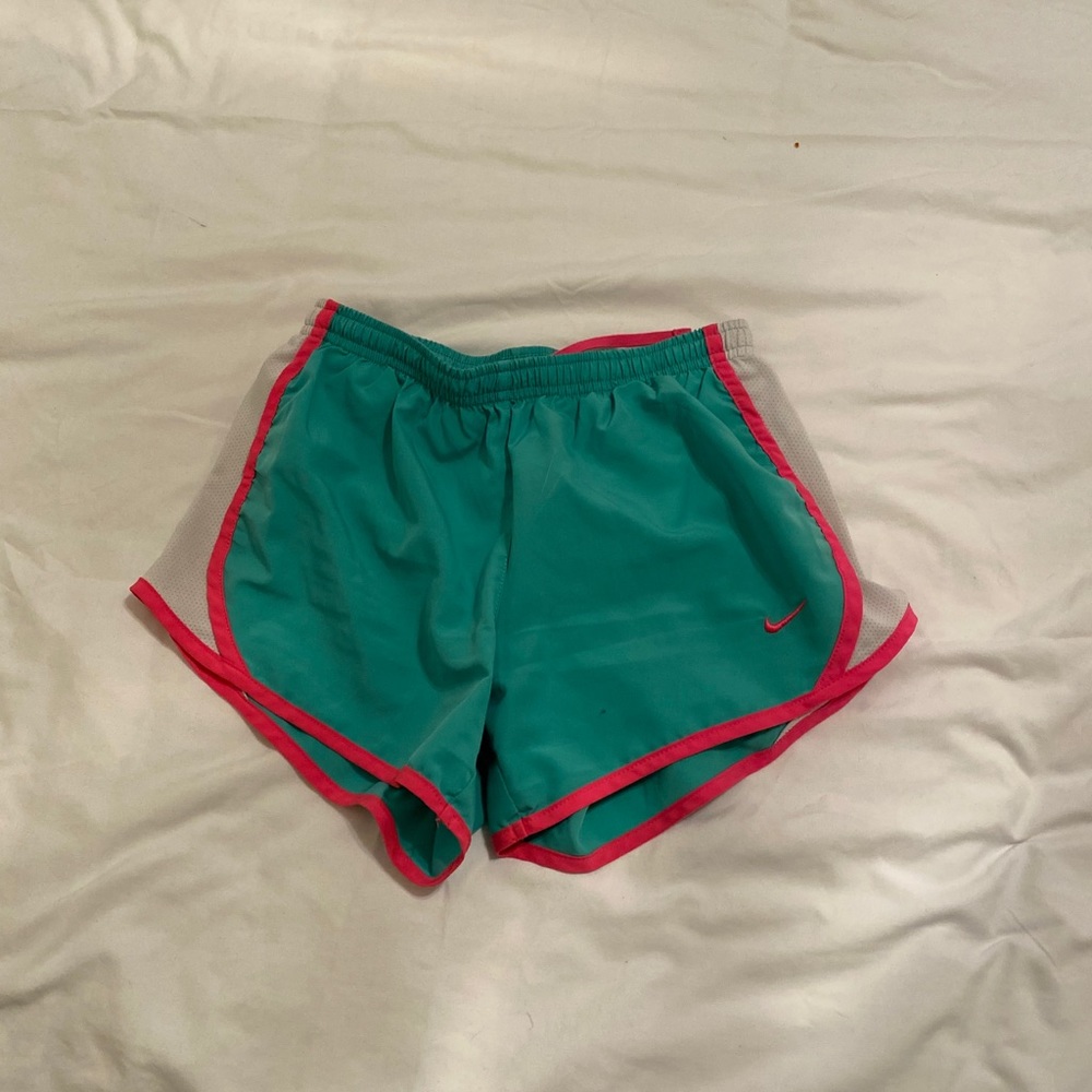 Green and pink Nike running shorts